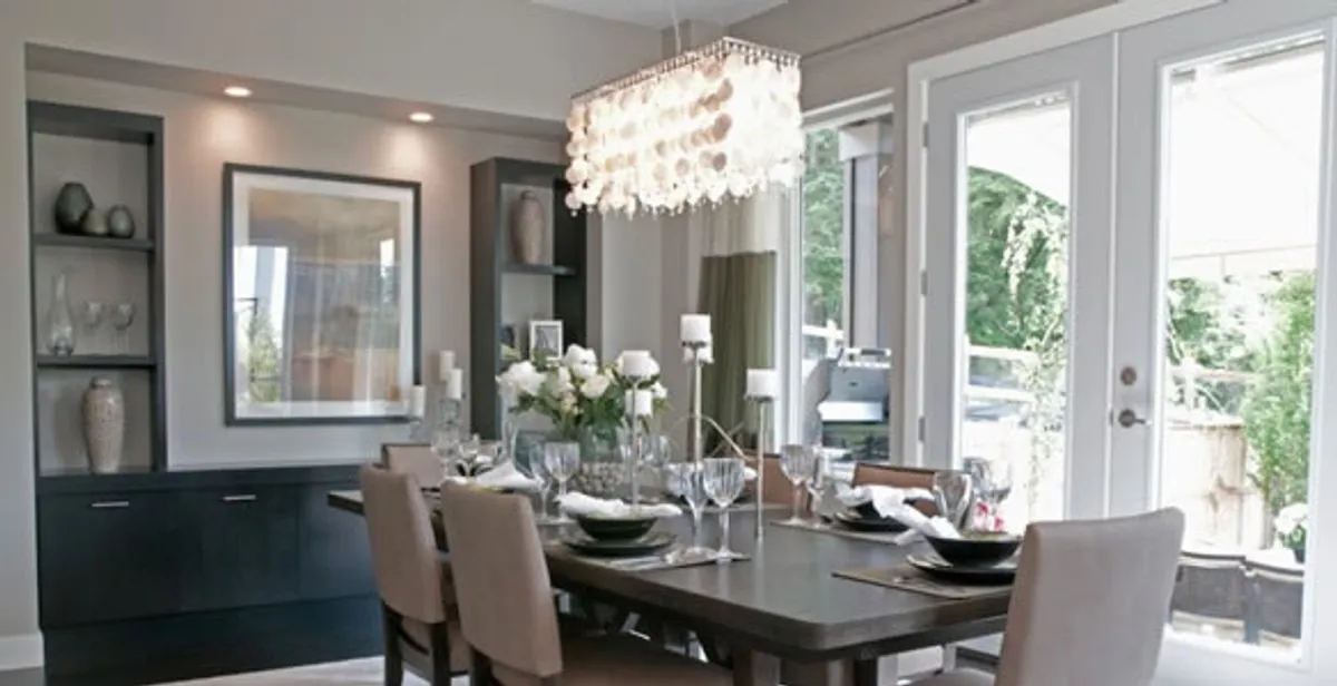 Elegant dining room chandelier installation above table in San Jose, CA