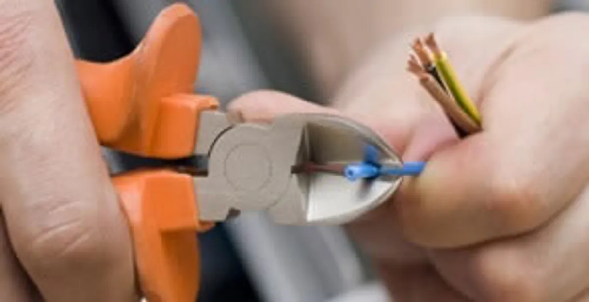 professional electrical services showing precise wire cutting by licensed electricians in San Jose, CA