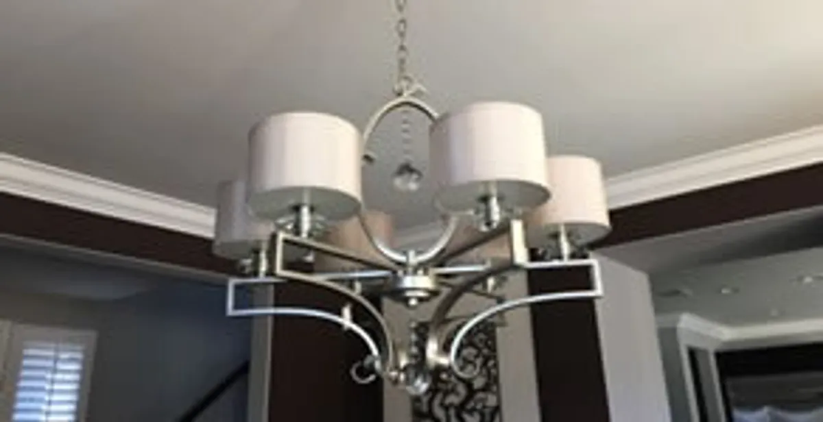 Modern chandelier installation with multiple light fixtures in San Jose, CA